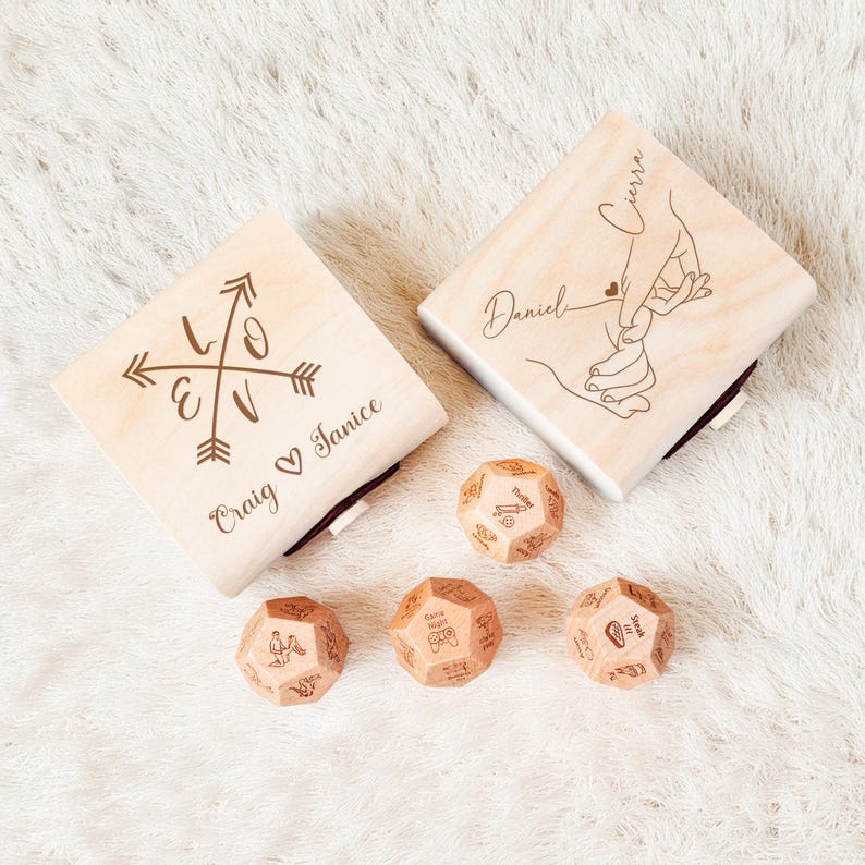 a couple of wooden dices sitting on top of a white rug