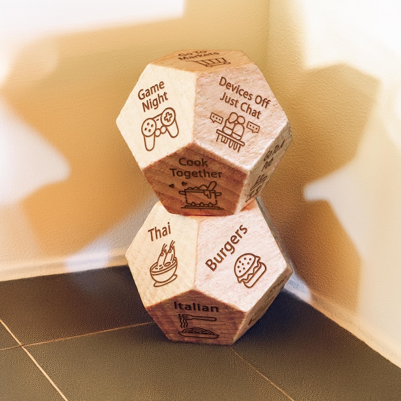 a couple of wooden dices sitting on top of a tiled floor