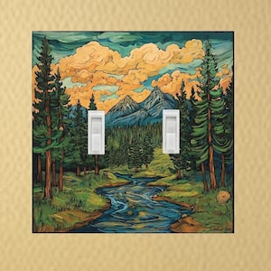 May include: A double light switch cover with a colorful illustration of a mountain landscape with a river flowing through it. The scene is painted in shades of blue, green, yellow, and brown.