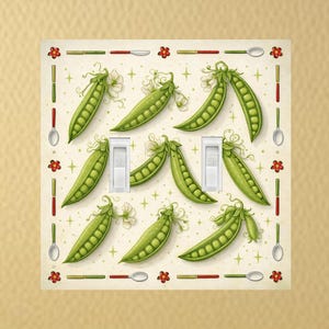 May include: A double light switch cover featuring a whimsical design of green pea pods. The cover has a cream-colored background with a border of red lines, spoons, and red flower accents. The pea pods are arranged around the switches.