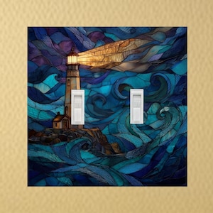 May include: A decorative light switch cover featuring a stained-glass design of a lighthouse. The artwork depicts a lighthouse with a bright beam of light shining over a stormy sea. The color palette includes shades of blue, purple, and gold.