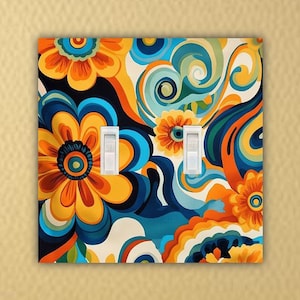 May include: A double light switch cover with a colorful abstract floral design featuring blue, yellow, and orange colors.