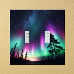 May include: A double light switch cover featuring a vibrant aurora borealis display over a dark forest silhouette. The aurora is a mix of pink, purple, green, and blue hues against a black starry sky.