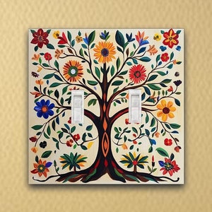 May include: A light switch cover featuring a colorful folk art style tree with flowers and leaves. The tree is painted in shades of red, yellow, blue, green, and white on a cream background.