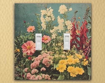 May include: A double light switch cover with a vintage floral design. The cover features a variety of flowers in shades of pink, yellow, red, and white, set against a blue background.