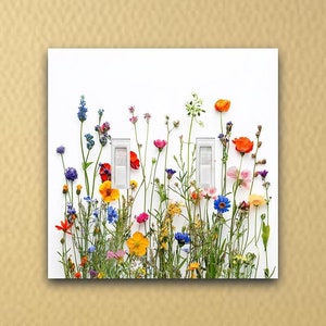 May include: A white light switch cover featuring a vibrant floral design. The cover is adorned with a variety of colorful wildflowers, including red poppies, yellow daisies, and blue cornflowers. The light switches are white.