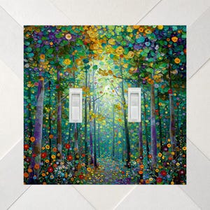 May include: A double light switch wall plate featuring a vibrant, textured oil painting of a forest scene with tall trees, colorful foliage in shades of green, yellow, orange, and purple, and a path covered in fallen leaves and flowers.