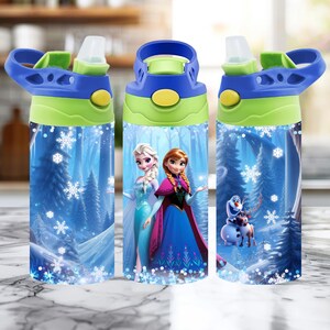 May include: Three blue and green water bottles featuring characters from the movie Frozen. The bottles have a blue and green lid with a flip-top spout. The bottles have a winter forest scene with snowflakes and the characters Elsa, Anna, and Olaf.