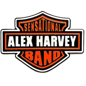 May include: A black and orange logo with the text "Sensational Alex Harvey Band" in a Harley Davidson style shield.
