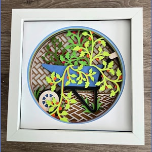 3D Shadow Box Art Featuring a Gardening Wheel Barrel with Plants