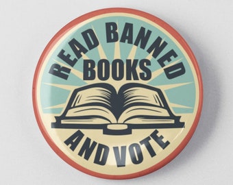May include: A red, white and blue button with the text "Read Banned Books and Vote" and an illustration of an open book.