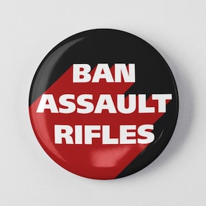 May include: A black and red button with the text "BAN ASSAULT RIFLES" in white.