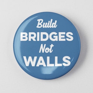 May include: A blue button with the text "Build Bridges Not Walls" in white.