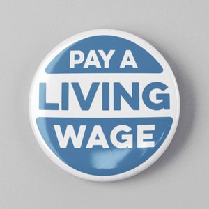 May include: A blue and white button with the text "PAY A LIVING WAGE" in white letters.