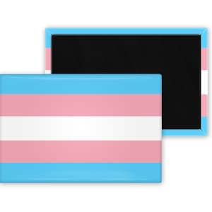 May include: A blue, white, and pink transgender pride flag magnet. The magnet is attached to a black backing.