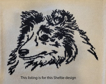 May include: Cream-colored knitted fabric featuring a black graphic of a Sheltie dog's head. The dog's fur is detailed with black lines. Text at the bottom reads, "This listing is for this Sheltie design."