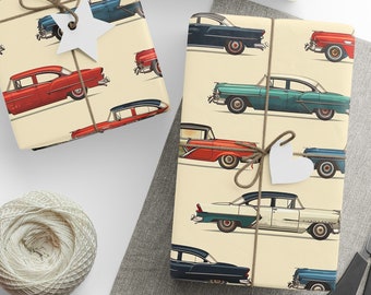 May include: A set of two vintage-style wrapping paper rolls featuring a repeating pattern of classic cars in various colors. The paper is cream-colored with a subtle texture.
