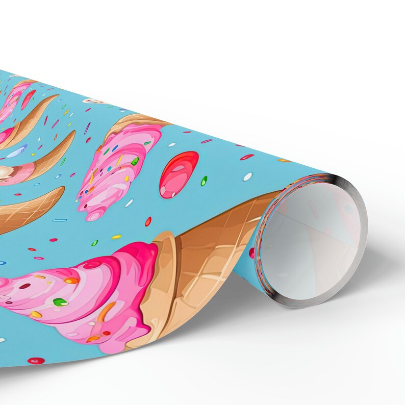 May include: A blue wrapping paper with a repeating pattern of pink ice cream cones with sprinkles and colorful candies.