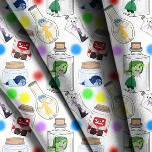 May include: A white fabric with a repeating pattern of colorful glass jars filled with cartoon characters. The characters are various shades of blue, green, red, and yellow. The jars are filled with different emotions, including sadness, anger, joy, and disgust.