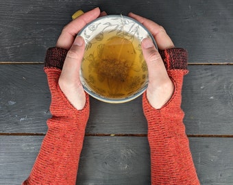 Knitted lambswool reversible wrist warmers in orange and brown