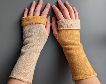 Knitted lambswool reversible wrist warmers in golden yellow and linen