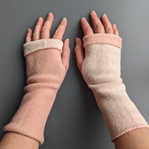 Knitted lambswool reversible wrist warmers in pastel pink and ecru image 1