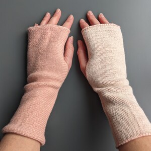 Knitted lambswool reversible wrist warmers in pastel pink and ecru image 2