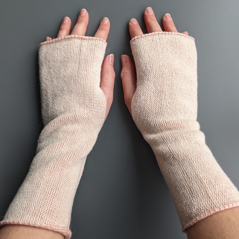 Knitted lambswool reversible wrist warmers in pastel pink and ecru image 6