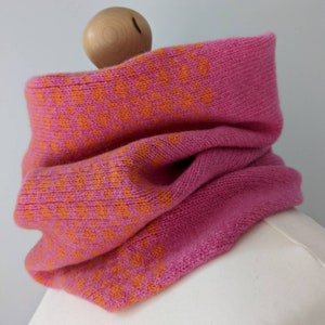 Lambswool knitted Fairisle cowl in dots and spots design orange and pink image 2