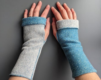 Knitted lambswool reversible wrist warmers in blue and pale grey