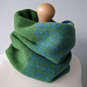 Lambswool knitted Fair Isle cowl in dots and spots design - grass with petrol blue spots