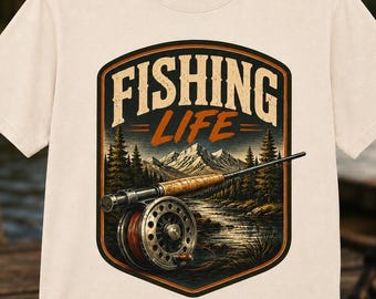 Maglietta vintage con motivo mulinello da pesca a mosca, colori rustici per il comfort all'aria aperta.