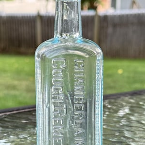 Vintage Chamberland’s hostmedicin – Des Moines, IA – Aquablå glasflaska
