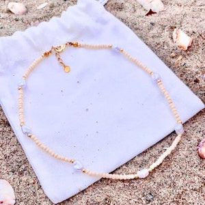 Collar de cuentas de semillas de dólar de arena