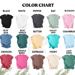 May include: A color chart displays various t-shirt colors, including black, white, pepper, bay, and blossom. Other colors are blue jean, blue spruce, butter, chalky mint, chambray, crimson, crunch berry, espresso, ivory, and light green.