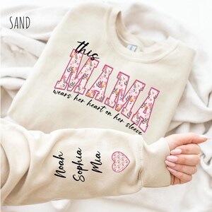 Personalized Mom Sweatshirt With Kids Names, Custom This Mama Wears Her Heart On Her Sleeve Hoodie, Cute Momma Outfit, Mothers Day Gifts