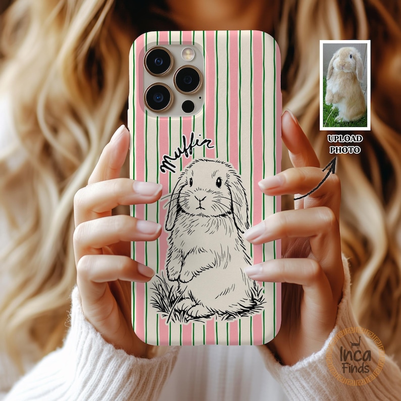 May include: A phone case with a vertical striped pattern in pink and green. The case features a black and white illustration of a bunny and the handwritten word "Muffin". A small photo of a bunny is in the upper right corner.