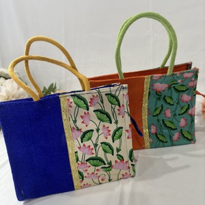 Full Jute bag with half side lotus print fabric stitched with zip closure