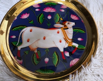 Laminated Pichwai cow print pure brass round trays