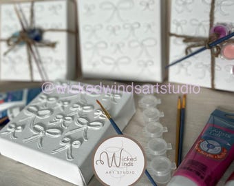 DIY Paint Your Own Textured Artpiece - Textured Bows with Paintbrush and paint on stretched canvas
