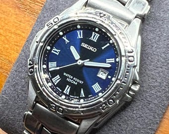 Seiko Ladies Blue Dial 7N82-6D49 Stainless Steel Watch - 100M Water Resistant - Roman Dial