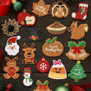 May include: A collection of embroidered patches with holiday and autumn themes. Designs include a Santa Claus, reindeer, pumpkin with "Happy Thanksgiving" text, Christmas tree, and a candy corn character. The patches are on a dark wood surface.