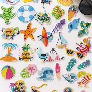 Parches termoadhesivos bordados hawaianos: Juego de 31 apliques tropicales