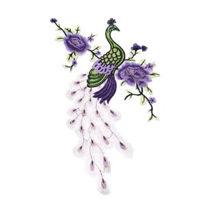 May include: Embroidered peacock patch featuring a green and purple body, white tail feathers with purple accents, and purple floral accents. The patch is designed with intricate details and a white background.