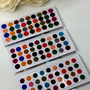 May include: Three sheets of colorful round velvet stickers. Each sheet has 36 stickers in various colors, including blue, green, red, orange, brown, pink, and black.