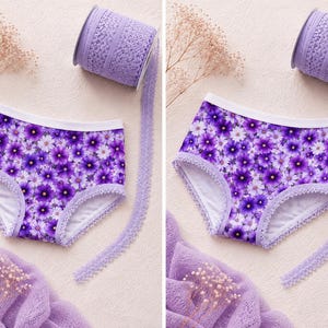 May include: A pair of purple floral print underwear with white trim and a matching lace ribbon. The underwear features a pattern of purple and white flowers. A roll of matching lace is visible in the background.