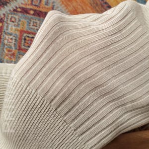 Detailed view of the loose cut neck band on these comfortable sleep socks that won't pinch.