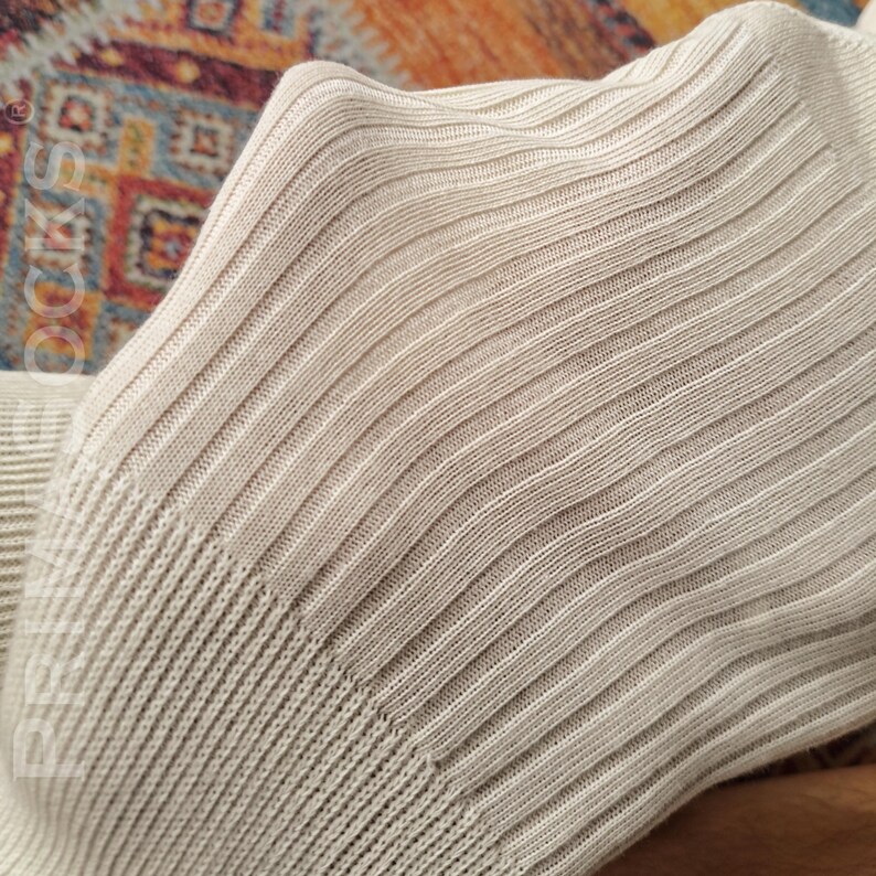 Detailed view of the loose cut neck band on these comfortable sleep socks that won't pinch.