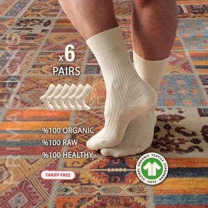 A value pack of 6 pairs of organic cotton socks for men, displayed in a bulk set. This sock bundle is GOTS certified, unbleached, and tariff-free, offering the best organic socks for sustainable living.