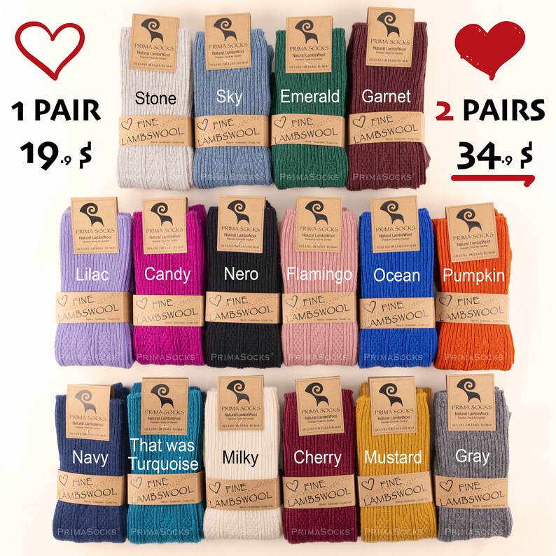 May include: A variety of 12 pairs of fine lambswool socks in different colors, including stone, sky, emerald, garnet, lilac, candy, nero, flamingo, ocean, pumpkin, navy, turquoise, milky, cherry, mustard, and gray. The socks are arranged in two rows of six. Each pair is labeled with the color name and the words "Fine Lambswool".